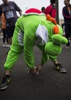 A participant in the 5th annual 374th Civil Engineer Squadron Running of the Bulls 10K stretches in a Halloween costume before the race on 28 Oct. 2016, Yokota Air Base, Japan. The event included a costume contest for participants who ran in their Halloween costumes. (U.S. Air Force photo by Airman 1st Class Donald Hudson/Released)