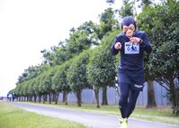 A participant in the 5th annual 374th Civil Engineer Squadron Running of the Bulls 10K points at the camera while running in costume on 28 Oct. 2016, at Yokota Air Base, Japan. The event included a costume contest for participants who ran in their Halloween costumes. (U.S. Air Force photo by Airman 1st Class Donald Hudson/Released)