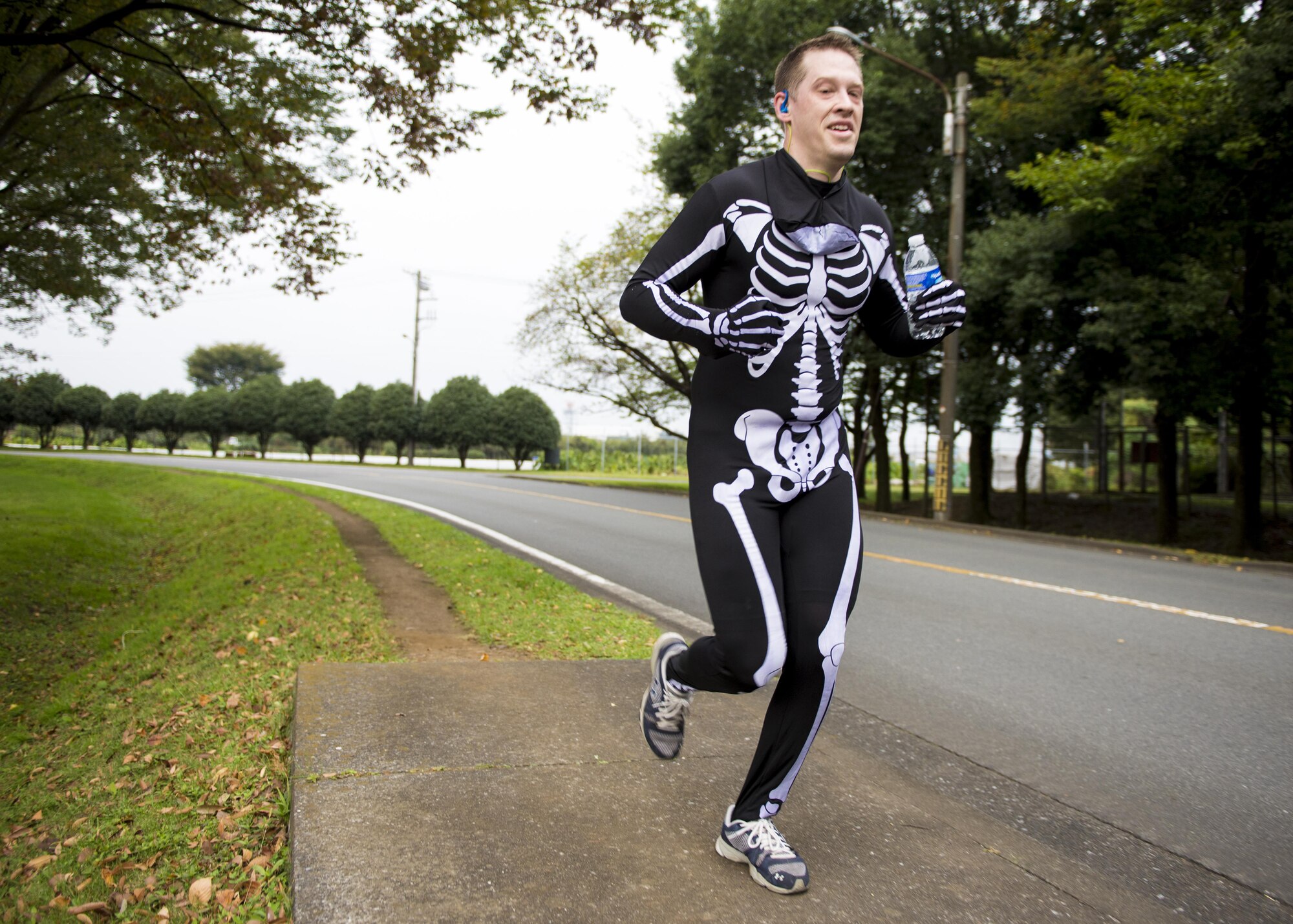 A participant runs in costume during the 5th annual 374th Civil Engineer Squadron Running of the Bulls 10K on 28 Oct. 2016, at Yokota Air Base, Japan. The event included a costume contest for participants who ran in their Halloween costumes. (U.S. Air Force photo by Airman 1st Class Donald Hudson/Released)