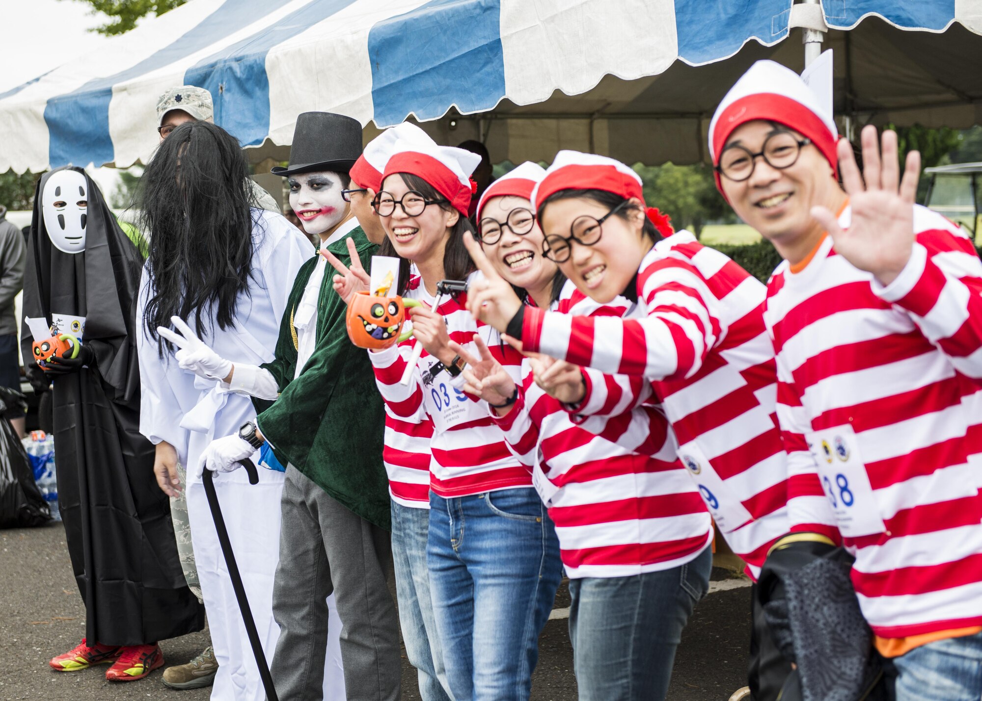 Winners of the costume contest for the 5th annual 374th Civil Engineer Squadron Running of the Bulls 10K pose for a photo on 28 Oct. 2016, at Yokota Air Base, Japan. The event included a costume contest for participants who ran in their Halloween costumes. (U.S. Air Force photo by Airman 1st Class Donald Hudson/Released)