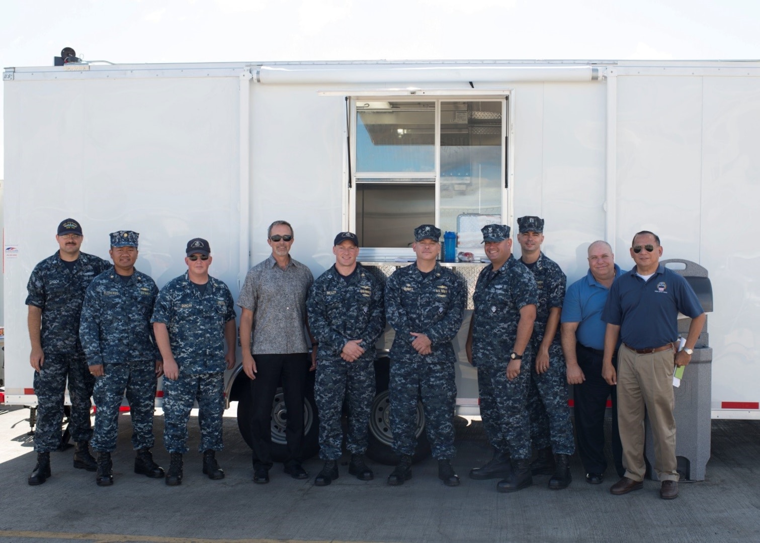 Personnel from DLA Troop Support Pacific, the Naval Submarine Support Command and the USS Columbus submarine are pictured in front of a new mobile galley at Joint Base Pearl Harbor-Hickam Oct. 25, 2016. The galley was purchase through DLA Troop Support’s Subsistence supply chain and is used for temporary food service while submarines are undergoing maintenance.