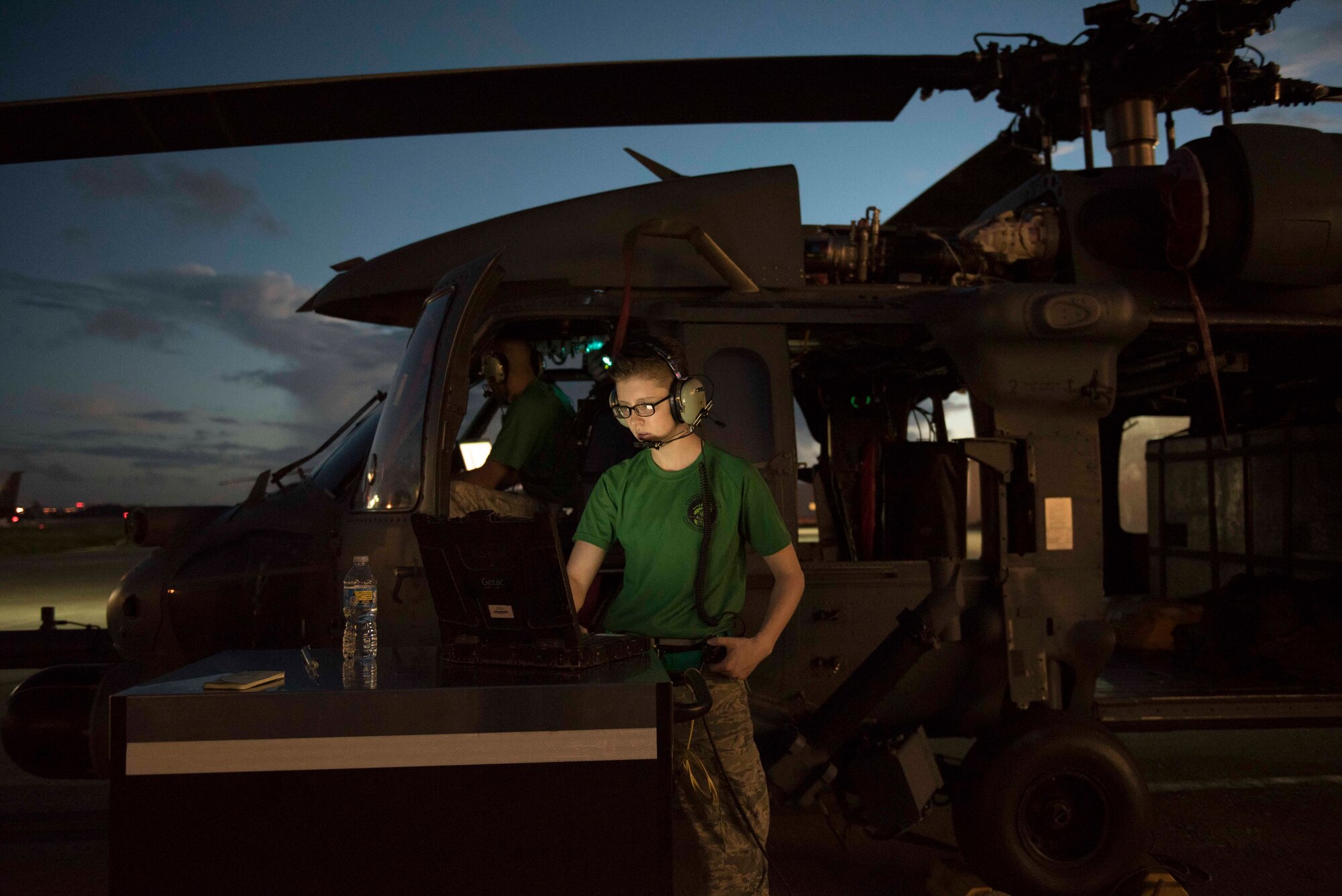 U.S. Air Force Airman 1st Class Jessica Games, 33rd Helicopter Maintenance Unit flight control systems technician, checks technical orders while performing maintenance on an HH-60G Pave Hawk Oct. 25, 2016, at Kadena Air Base, Japan. The 33rd HMU technicians work around the clock to ensure the helicopters are deployable at a moment’s notice. (U.S. Air Force photo by Senior Airman Omari Bernard/Released)