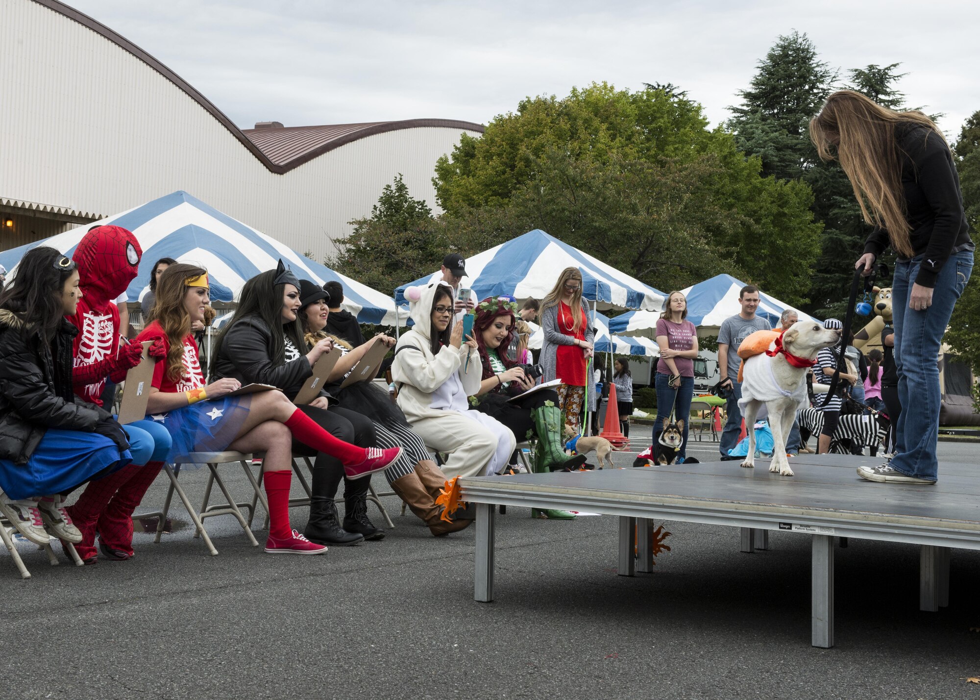 Participant in the 374th Force Support Squadron’s Howl-O-Ween Pawty costume contest show pets to judges on Oct. 29, 2016, at Yokota Air Base, Japan. The family event gave over 60 participants the chance to meet other pet owners from around the base. (U.S. Air Force photo by Airman 1st Class Donald Hudson/Released)