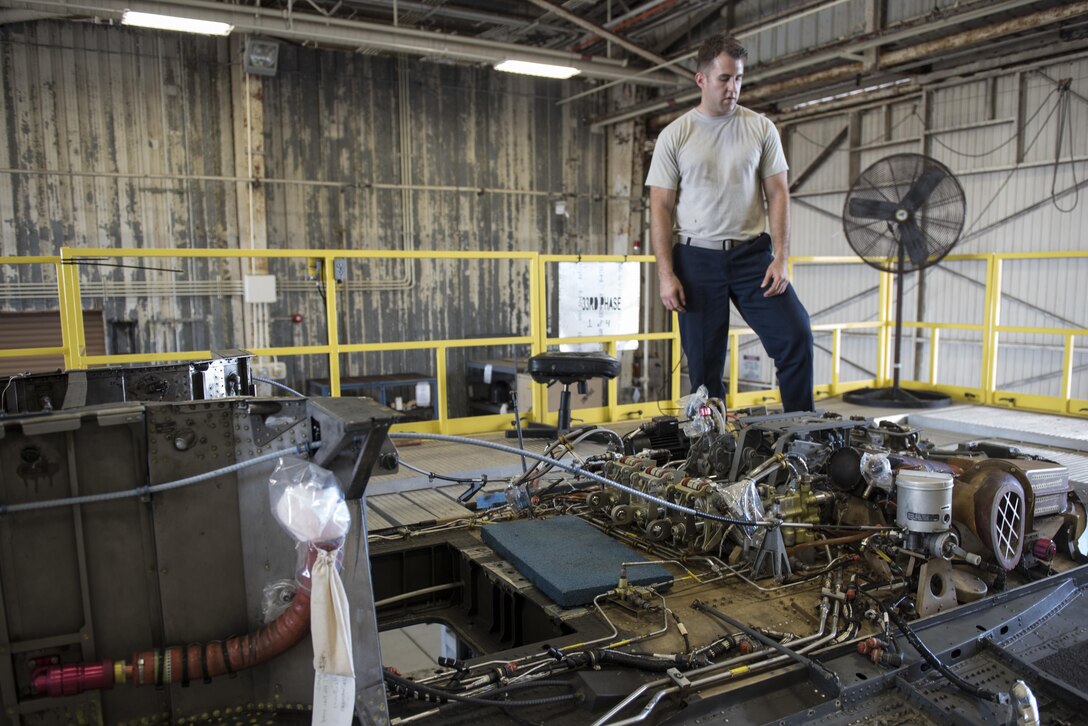 U.S. Air Force Senior Airman Timothy Boling, 33rd Helicopter Maintenance Unit HH-60G crewchief, inspects the roof of an HH-60G Pavehawk during a phase inspection Oct. 26, 2016, at Kadena Air Base, Japan. During the phase inspection crewchiefs examine every inch of the aircraft to ensure serviceability. (U.S. Air Force photo by Senior Airman Omari Bernard)