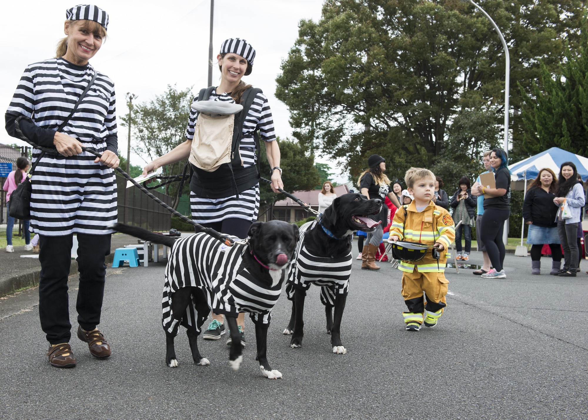 Participants in the 374th Force Support Squadron’s Howl-O-Ween Pawty costume contest pose for a photo Oct. 29, 2016, at Yokota Air Base, Japan. The event included activities and games for families, including: sumo wrestling suits, bounce castle and face painting. (U.S. Air Force photo by Airman 1st Class Donald Hudson/Released)