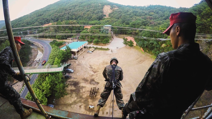 Republic of Korea Marines assist U.S. Marines with Combat Logistics 3, 3d Marine Logistics Group, III Marine Expeditionary Force, down a rappel tower during Winter Workhorse 16 at the Mountain Warfare Training Center in Pohang, Republic of Korea, October 10, 2016. One of the goals of Winter Workhorse is to refine 3rd Marine Logistics Group's combat skills in order to focus on combat readiness. Strengthening partnerships with regional allies, and enhancing response capabilities, helps maintain peace and regional security.