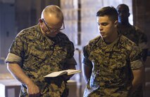 U.S. Marine Corps Lt. Gen. Lawrence D. Nicholson, Left, the commanding general for III Marine Expeditionary Force, reviews Cpl. Matthew A. Long’s, Right, a motor transport mechanic with Motor Transport Company, 3rd Marine Logistics Group, III MEF, design for a self-aiding device to be attached to the small arms protective insert plates worn by Marines in combat on Camp Kinser, Okinawa, Japan, Oct. 20, 2016. Long was selected as a winner in a Marine Corps wide competition for logistical innovation. Long came up with the design in attempt to save Marines’ lives in combat by minimizing the amount of time between being injuring and receiving aid. (U.S. Marine Corps photo by Sgt. William Hester)