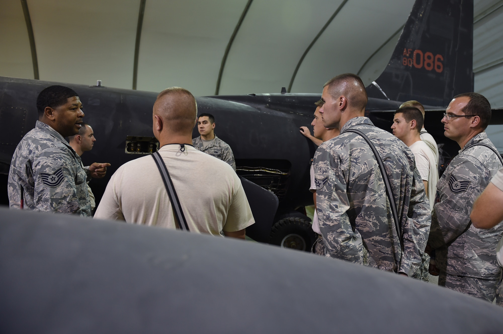 Tech. Sgt. Hart and Airman 1st Class Jesus, 380th Expeditionary Aircraft Maintenance Squadron, lead members of the 380th Expeditionary Civil Engineer Squadron Fire Department through familiarization with the main areas to check for hydrazine leaks on a U-2 Dragon Lady during training at an undisclosed location in Southwest Asia, Oct. 27, 2016. The U-2 uses hydrazine as part of a back-up system that will allow the pilot to restart the engine in case of failure. (U.S. Air Force photo by Tech. Sgt. Christopher Carwile)