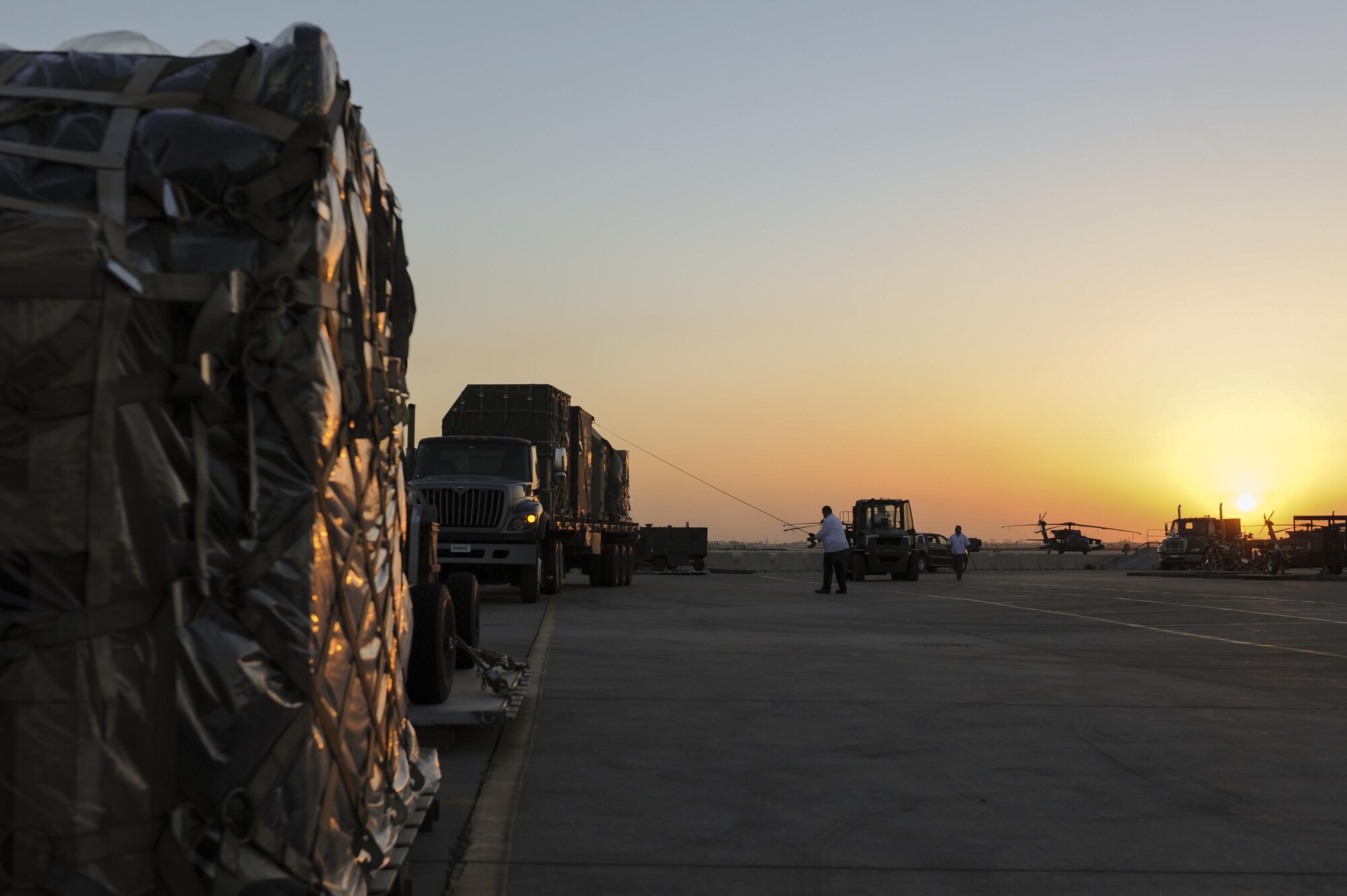 Contractors assigned to the 39th Logistics Readiness Squadron strap down cargo Oct. 19, 2016, at Incirlik Air Base, Turkey. The equipment will be used by members of the 447th Air Expeditionary Group to conduct missions in support of Operation INHERENT RESOLVE. (U.S. Air Force photo by Airman 1st Class Devin M. Rumbaugh)