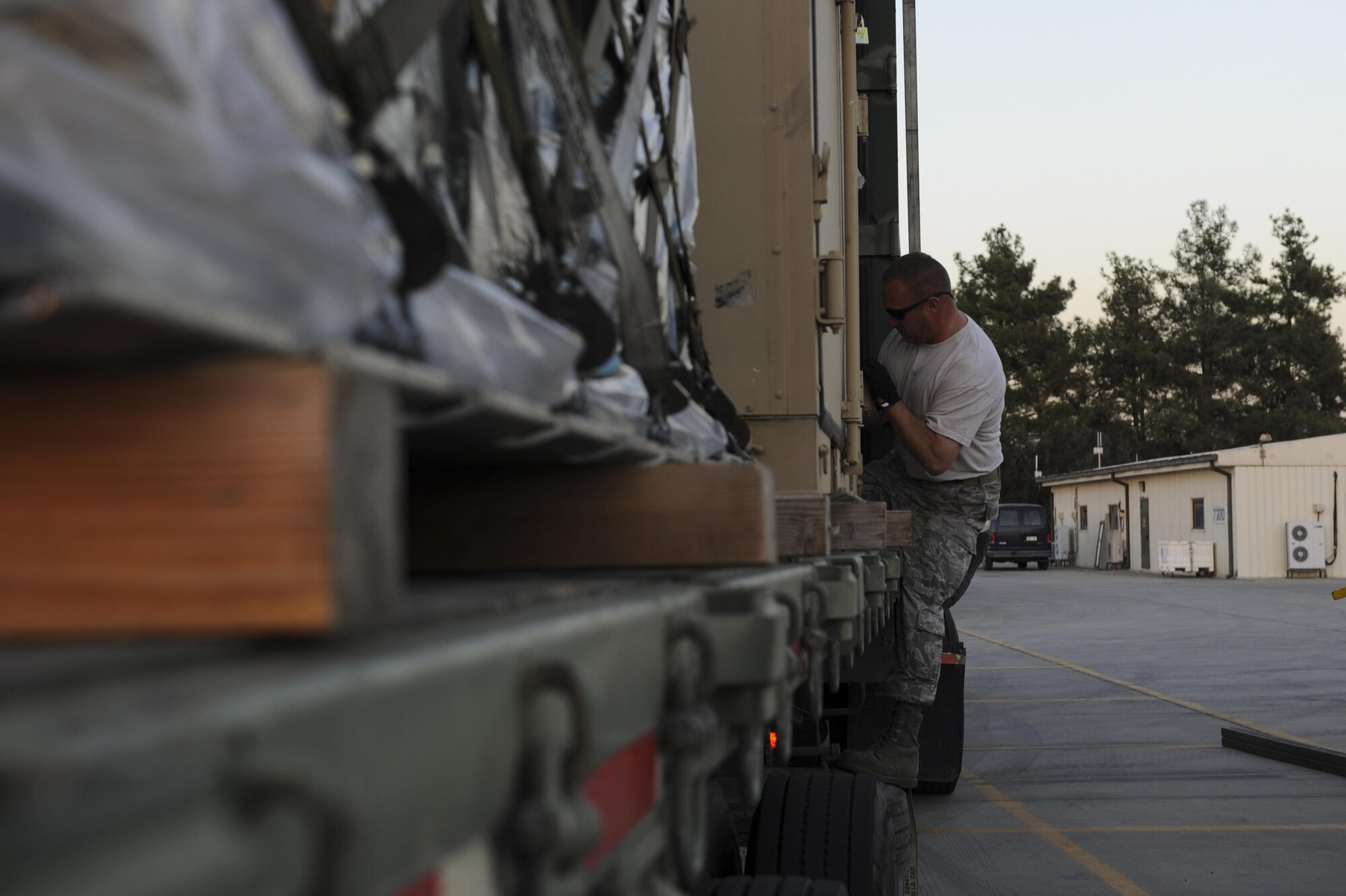 U.S. Air Force Senior Master Sgt. Duane Caton, 447th Expeditionary Air Maintenance Squadron (EAMXS) support section NCO in charge, tightens a cargo strap Oct. 19, 2016, at Incirlik Air Base, Turkey. The 447th EAMXS provides maintenance needs to aircraft involved in Operation INHERENT RESOLVE. (U.S. Air Force photo by Airman 1st Class Devin M. Rumbaugh)