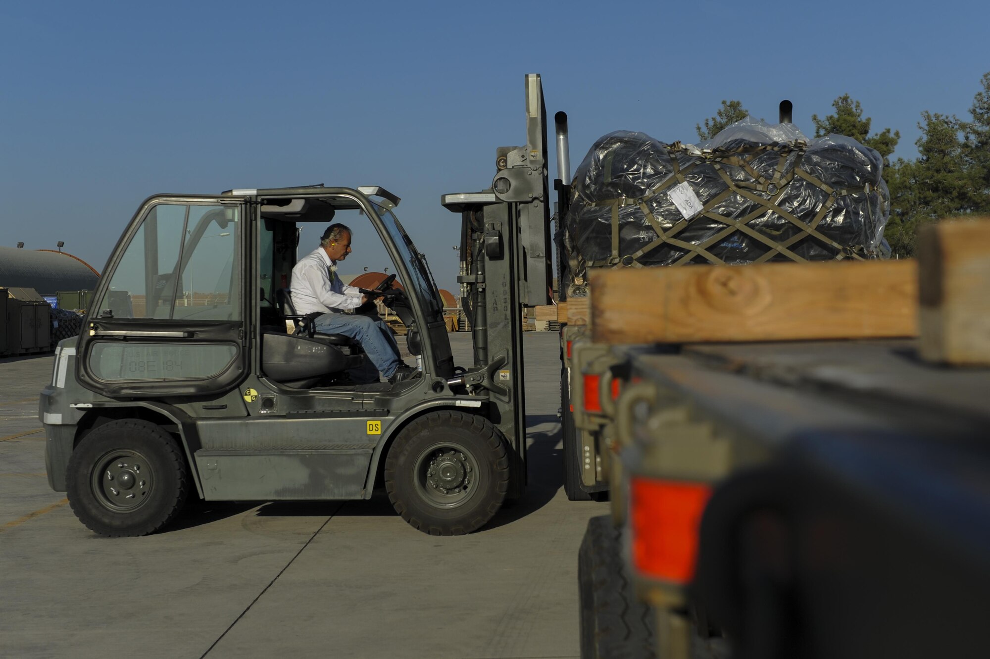 Contractors assigned to the 39th Logistics Readiness Squadron load a pallet onto a semi-truck Oct. 19, 2016, at Incirlik Air Base, Turkey. The 39th LRS aids Operation INHERENT RESOLVE by moving cargo via ground, fueling, and vehicle operations. (U.S. Air Force photo by Airman 1st Class Devin M. Rumbaugh)