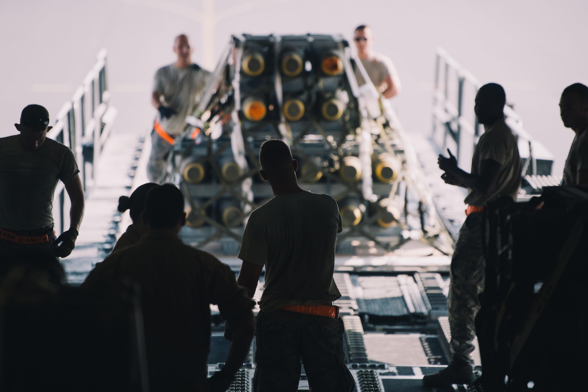 Airmen with the 8th Expeditionary Air Mobility Squadron and 816th Expeditionary Airlift Squadron load cargo into a C-17 Globemaster III in support of Combined Joint Task Force - Operation Inherent Resolve at Al Udeid Air Base, Qatar, Oct. 28, 2016. These squadrons are actively engaged in tactical airlift operations supporting the Mosul offensive. (U.S. Air Force photo by Senior Airman Jordan Castelan)