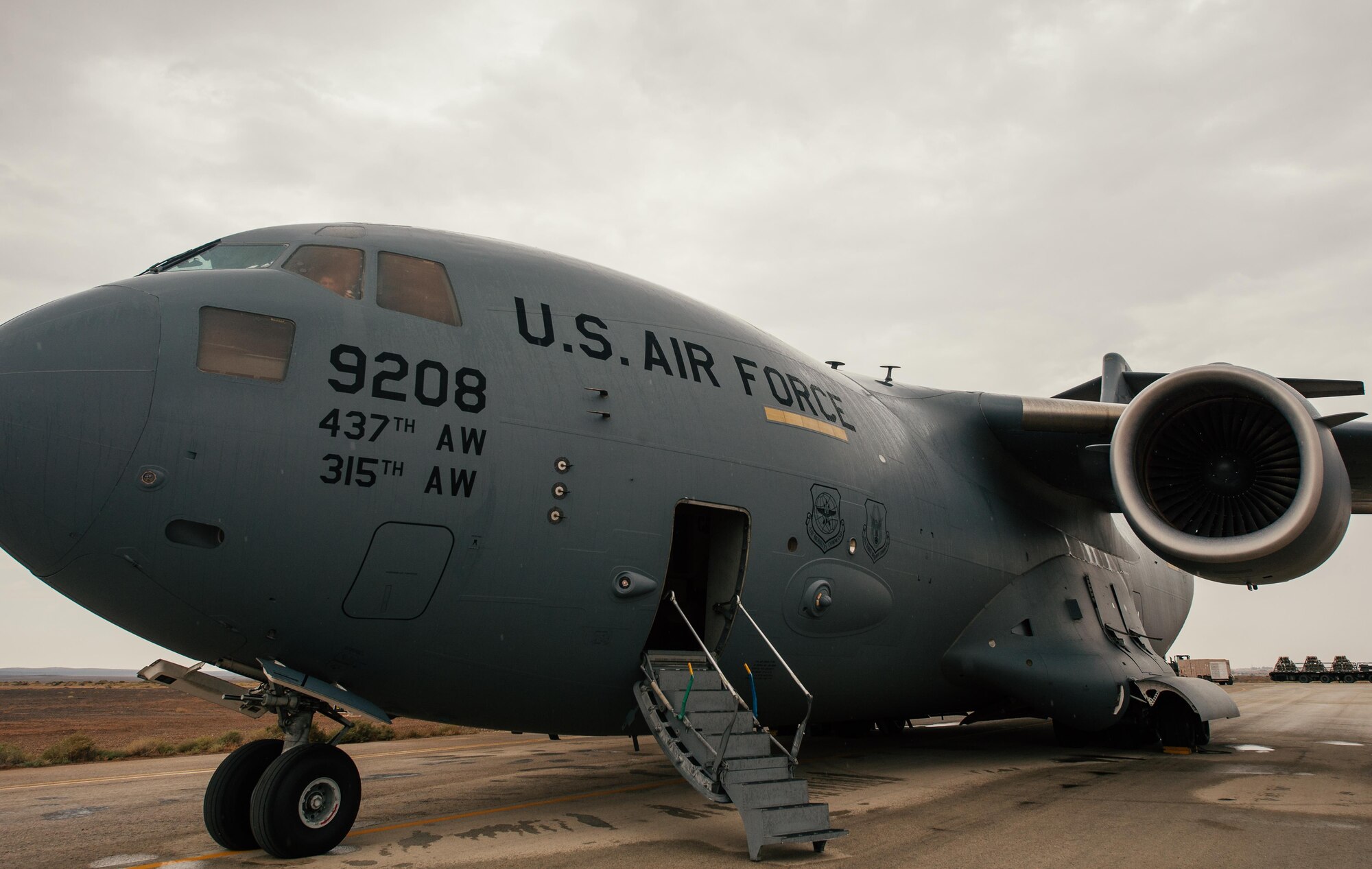 An 816th Expeditionary Airlift Squadron C-17 Globemaster III sits on a flightline in an undisclosed location while cargo is unloaded in support of Combined Joint Task Force - Operation Inherent Resolve, Oct. 28, 2016. The squadron is actively engaged in tactical airlift operations supporting the Mosul offensive. (U.S. Air Force photo by Senior Airman Jordan Castelan)