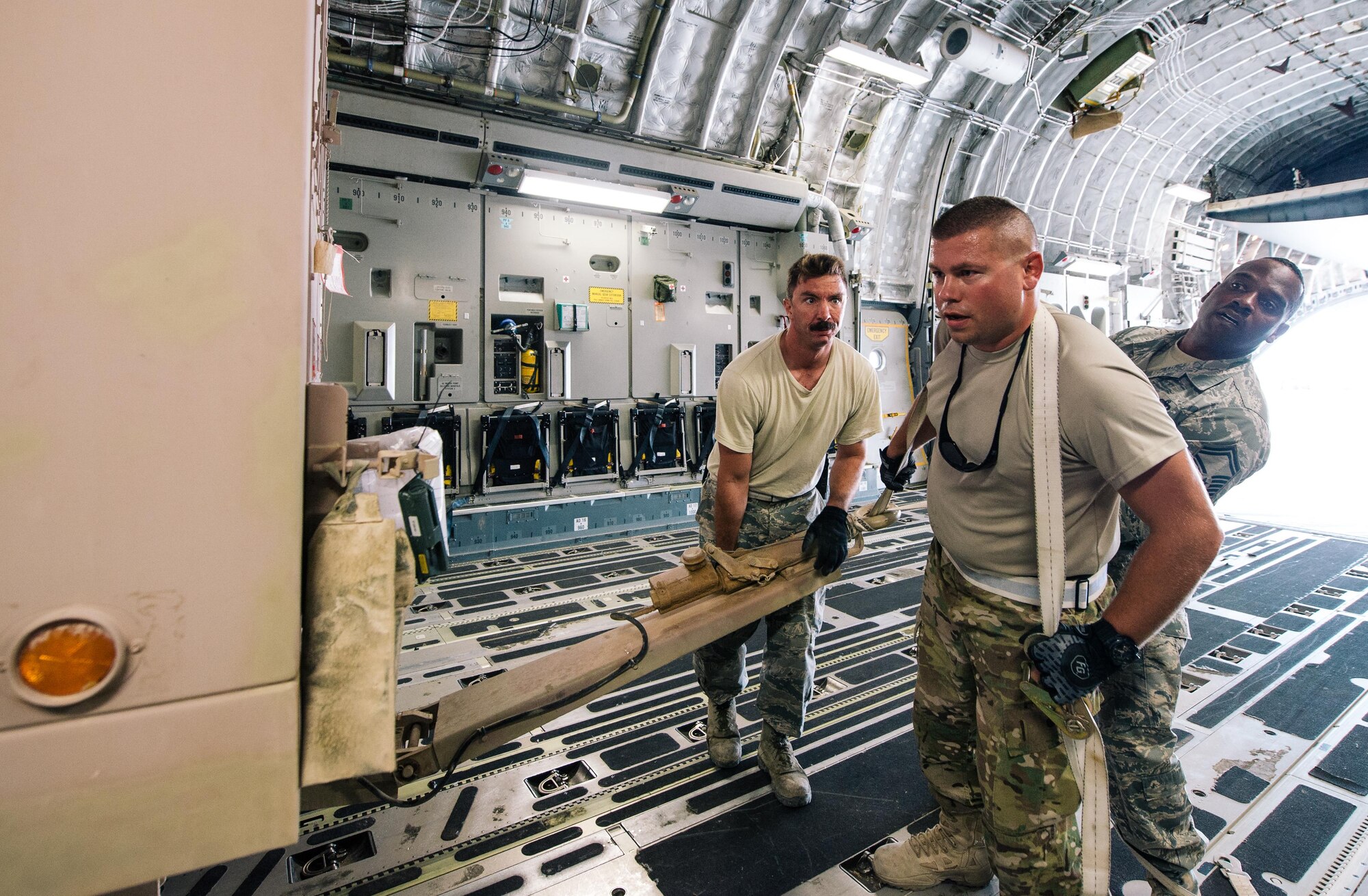 Airmen with the 332nd Expeditionary Logistics Readiness Squadron help load a generator into an 816th Expeditionary Airlift Squadron C-17 Globemaster III in support of Combined Joint Task Force - Operation Inherent Resolve, Oct. 28, 2016. These squadrons are actively engaged in tactical airlift operations supporting the Mosul offensive. (U.S. Air Force photo by Senior Airman Jordan Castelan)