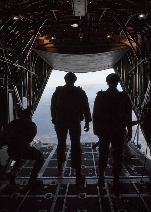 Airmen prepare to conduct a high-altitude, low-opening parachute jump from a C-130 Hercules aircraft over Yokota Air Base, Japan, Oct. 26, 2016. Air Force photo by Airman 1st Class Donald Hudson