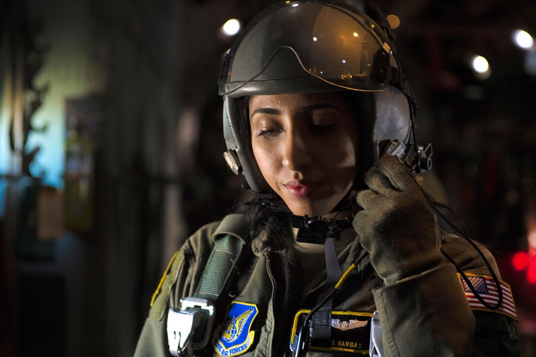 An Air Force flight crew member talks with the pilots of a C-130 Hercules aircraft before conducting a personnel drop training exercise at Yokota Air Base, Japan, Oct. 26, 2016. Air Force photo by Airman 1st Class Donald Hudson