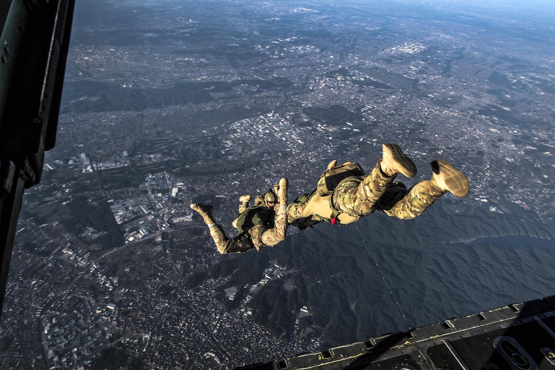 Air Force airmen freefall after jumping out of a C-130 Hercules aircraft during a high-altitude, low-opening parachute drop over Yokota Air Base, Japan, Oct. 26, 2016. Air Force photo by Airman 1st Class Donald Hudson