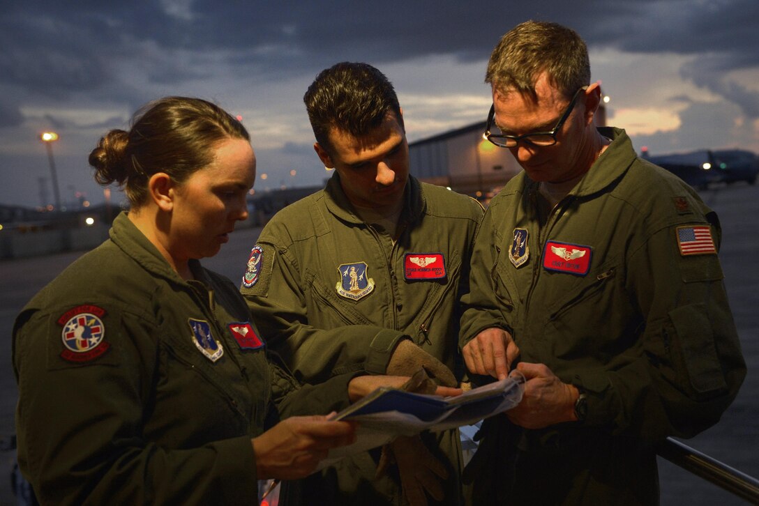 From right, Air Force Maj. Casey Patton, Senior Airman Joshua Hommen-Roddy and Tech. Sgt. Valerie Hogrefe review a training guide during an aeromedical evacuation training scenario for Southern Strike 17 at the Gulfport Combat Readiness Training Center, Miss., Oct. 26, 2016. Patton is a flight nurse, and Hommen-Roddy and Hogrefe are medical technicians assigned to the 137th Aeromedical Evacuation Squadron. Southern Strike 17 is a total force, multi-service training exercise hosted by the Mississippi Air National Guard’s Combat Readiness Training Center in Gulfport, Miss., from Oct. 24 through Nov. 4, 2016. The exercise emphasizes air-to-air, air-to-ground and special operations forces training opportunities. Air Force photo by Staff Sgt. Michael Battles