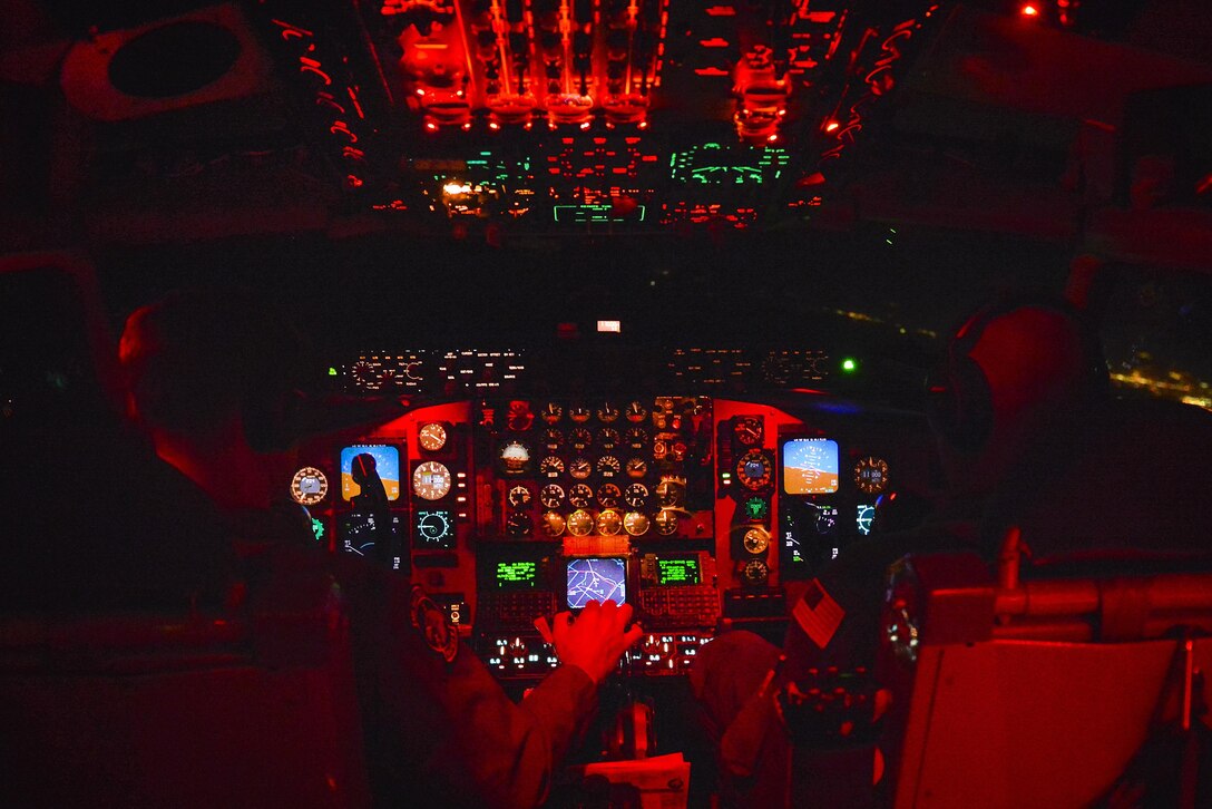 Air Force Maj. Jason Putman, left, flies a KC-135 Stratotanker aircraft during an aeromedical evacuation training scenario for Southern Strike 17 over Gulfport Combat Readiness Training Center, Miss., Oct. 26, 2016. Putman is a pilot assigned to the 153rd Air Refueling Squadron. Air Force photo by Staff Sgt. Michael Battles