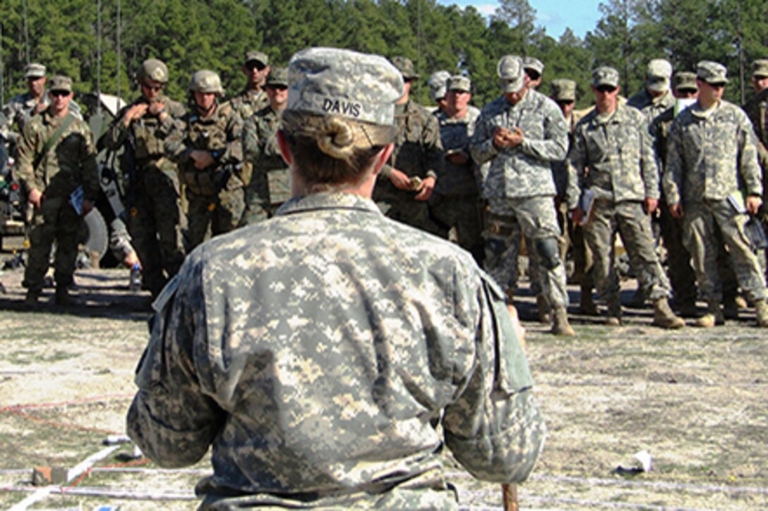 Army Battalion Adjutant 2nd Lt. Kelsey Davis describes the personnel, casualty and replacement portions of a simulated combat scenario during a combined arms rehearsal at Peason Ridge during the Joint Readiness Training Center’s 16-04 rotation on Fort Polk, La., Feb. 12, 2016. Army photo by Capt. Richard Packer