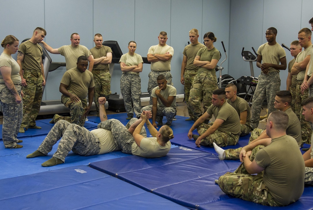 Staff Sgt. Crystal Baetz, a U.S. Army Reserve military police Soldier with the 603rd Military Police Company in Belton, Missouri, teaches a combatives level one familiarization class during battle assembly at the 603rd MP Co., Oct. 15. Baetz has certified more than 500 Soldiers across the 200th Military Police Command in levels one and two combatives. In addition to her duties in the Army Reserve, she is also the first female interior firefighter at Highland Park Fire Department in Michigan, a 911 dispatcher at Roscommon County and a combatives level four qualified instructor.  In order to be level four qualified, Baetz had to go through approximately 440 hours of training. (U.S. Army Reserve photo by Sgt. Stephanie Ramirez)