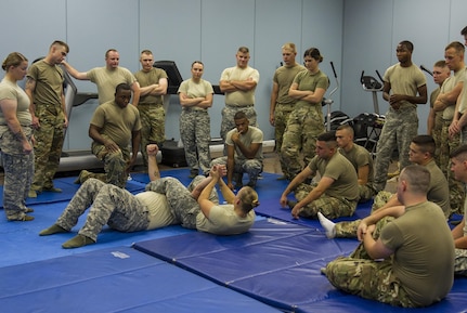 Staff Sgt. Crystal Baetz, a U.S. Army Reserve military police Soldier with the 603rd Military Police Company in Belton, Missouri, teaches a combatives level one familiarization class during battle assembly at the 603rd MP Co., Oct. 15. Baetz has certified more than 500 Soldiers across the 200th Military Police Command in levels one and two combatives. In addition to her duties in the Army Reserve, she is also the first female interior firefighter at Highland Park Fire Department in Michigan, a 911 dispatcher at Roscommon County and a combatives level four qualified instructor.  In order to be level four qualified, Baetz had to go through approximately 440 hours of training. (U.S. Army Reserve photo by Sgt. Stephanie Ramirez)