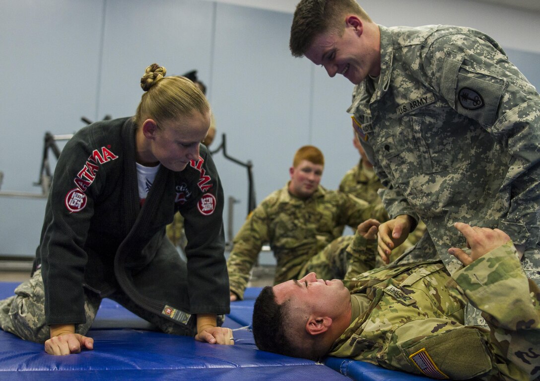 Staff Sgt. Crystal Baetz, a U.S. Army Reserve military police Soldier with the 603rd Military Police Company in Belton, Missouri, teaches a combatives level one familiarization class during battle assembly at the 603rd MP Co., Oct. 15. Baetz has certified more than 500 Soldiers across the 200th Military Police Command in levels one and two combatives. In addition to her duties in the Army Reserve, she is also the first female interior firefighter at Highland Park Fire Department in Michigan, a 911 dispatcher at Roscommon County and a combatives level four qualified instructor.  In order to be level four qualified, Baetz had to go through approximately 440 hours of training. (U.S. Army Reserve photo by Sgt. Stephanie Ramirez)