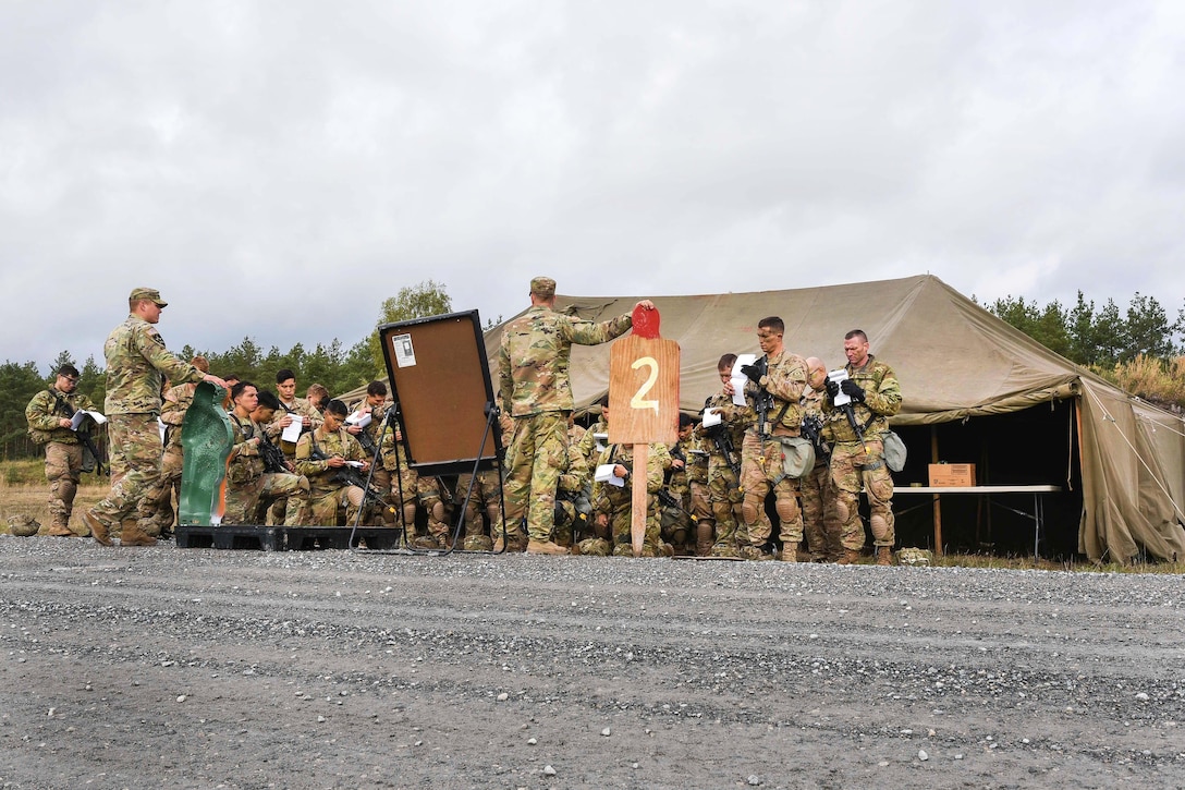 Soldiers receive a mission and safety brief before entering the hand grenade range during training to earn the Expert Infantryman Badge at the Grafenwoehr Training Area in Germany, Oct. 20, 2016. The soldiers are assigned to the 2nd Cavalry Regiment, 173rd Airborne Brigade, and 1st Battalion, 4th Infantry Regiment. The Expert Infantryman Badge is worn by infantrymen who have demonstrated a mastery of critical tasks. Army photo by Spc. Nathanael Mercado