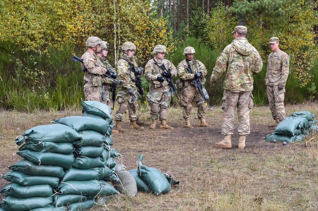 A range safety instructs soldiers on the hand grenade range during training to qualify for the Expert Infantryman Badge at the Grafenwoehr Training Area in Germany, Oct. 20, 2016. Army photo by Spc. Nathanael Mercado