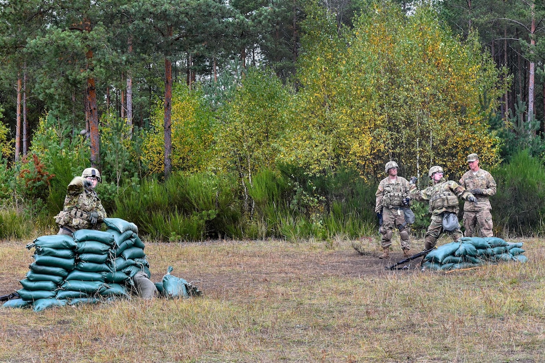 Soldiers practice throwing training hand grenades during training to earn the Expert Infantryman Badge at the Grafenwoehr Training Area in Germany, Oct. 20, 2016. Army photo by Spc. Nathanael Mercado 