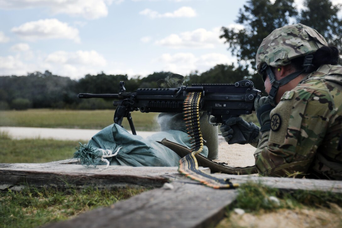Spc. Kristyn Howell, a signal support specialist with the 316th Sustainment Command (Expeditionary), a Army Reserve unit from Coraopolis, Pa., fires the M249 Light Machine Gun at a III Corps and Fort Hood firing range Oct 26, 2016 at Fort Hood, Tx., as part of the pre-mobilization training given to the 316th ESC.(U.S. Army photo by Sgt. Christopher Bigelow)