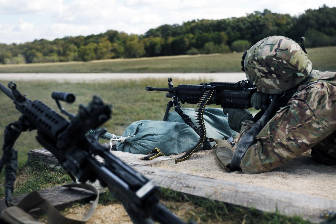 316th Sustainment Command (Expeditionary) Soldiers, fire the M249 Light Machine Gun at a III Corps and Fort Hood firing range Oct 26, 2016 at Fort Hood, Tx., as part of their pre-mobilization training. The 316th ESC is a Army Reserve unit from Coraopolis, Pa. (U.S. Army photo by Sgt. Christopher Bigelow)