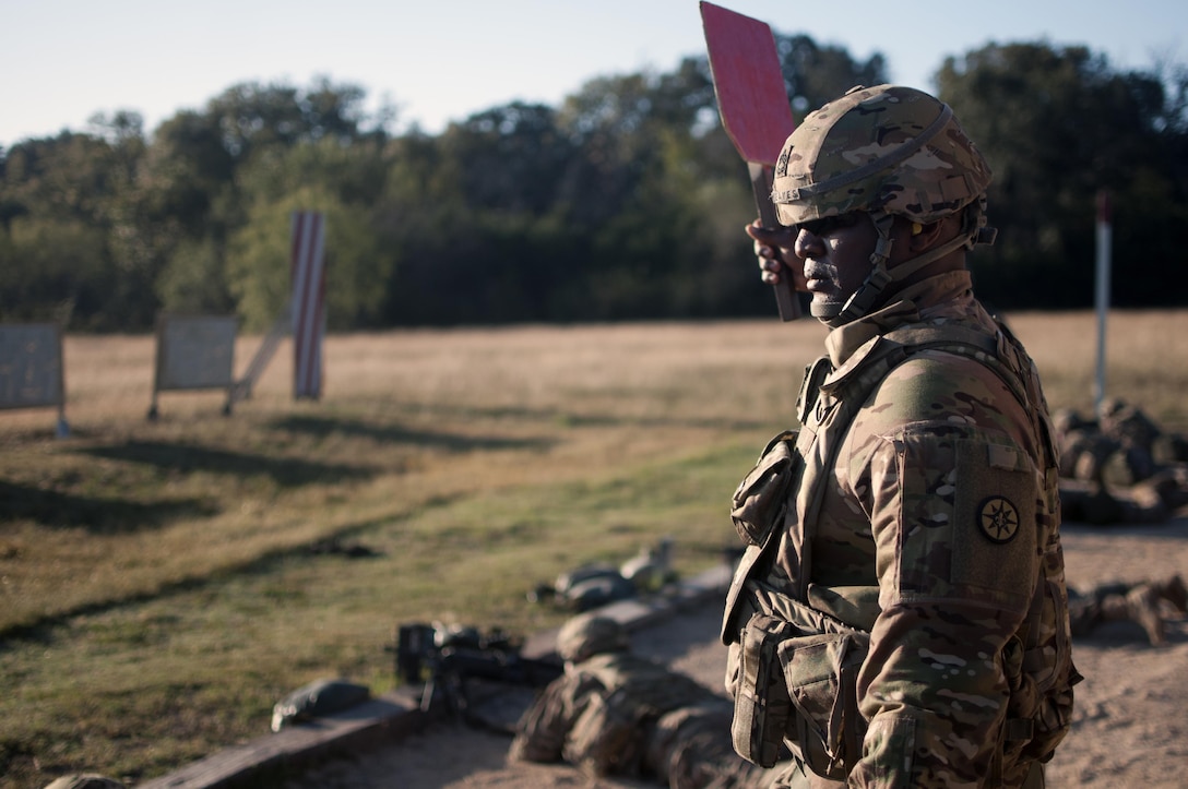 Sgt. 1st Class Barry Reaves, the senior equal opportunity adviser with the 316th Sustainment Command (Expeditionary), a Army Reserve unit from Coraopolis, Pa., supervises soldiers as a firing range safety officer at a M249 Light Machine Gun firing range hosted by III Corps and Fort Hood Oct 26, 2016 at Fort Hood, Tx.(U.S. Army photo by Sgt. Christopher Bigelow)