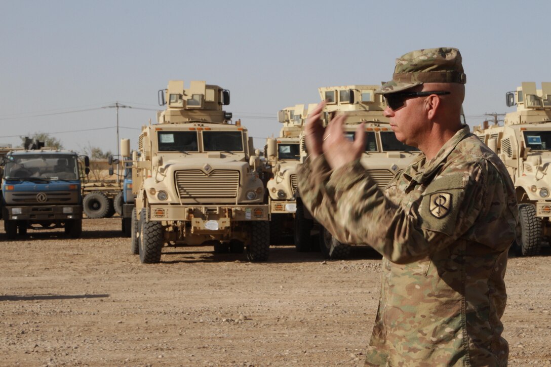 U.S. Army Reserve Warrant Officer 4 John Crane, senior accountable officer,1st Theater Sustainment Command-Operational Command Post, oversees the receipt of an Iraq Train and Equip Fund shipment of vehicles, worth more than $34.3 million, and assists 336th Combat Support Sustainment Battalion soldiers in accounting for and dismounting them, at an undisclosed location in Iraq, Sept. 24, 2016. The mine resistant ambush protected vehicles, also known as MRAPs, and water trucks are scheduled to be distributed to the Iraqi security forces to help them fight Da’esh.