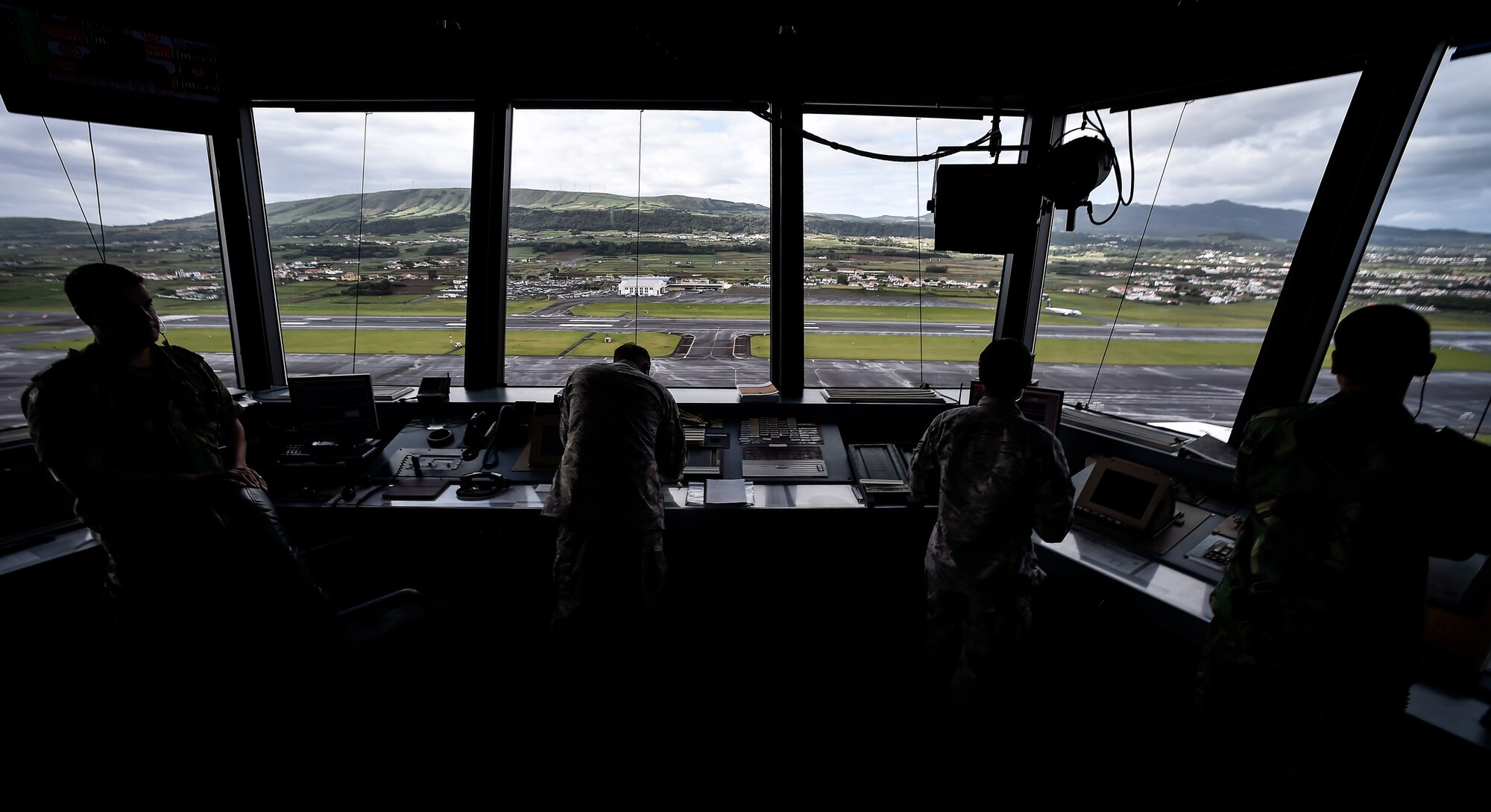 Air traffic controllers watch the flightline at Lajes Field, Azores, Portugal, Oct. 5, 2016. Six hours away from its parent wing, at Ramstein Air Base, Germany, this geographically-separated unit is home to more than 600 Airmen including local nationals who serve there. (U.S. Air Force photo by Senior Airman Nicole Keim)