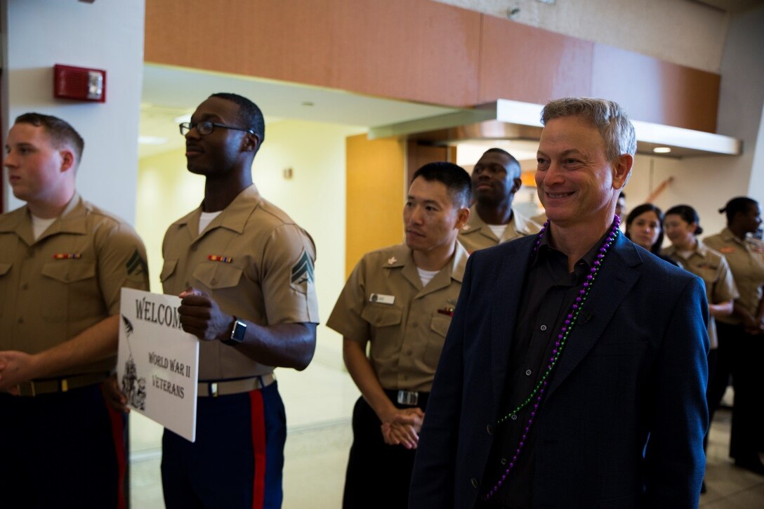 Actor Gary Sinise waits with Marines from Marine Corps Support Facility New Orleans at Louis Armstrong New Orleans International Airport for the arrival of World War II veterans on a Soaring Valor Honor Flight, Oct. 27, 2016. In 2015, the Gary Sinise Foundation launched the Soaring Valor Honor Flight program with the National WWII Museum, with the goal of preserving each veteran’s first-person account of the war. Each time a flight arrives, the Marines welcome the veterans to recognize their service to the nation. (U.S. Marine Corps photo by Cpl. Melissa Martens/ Released)