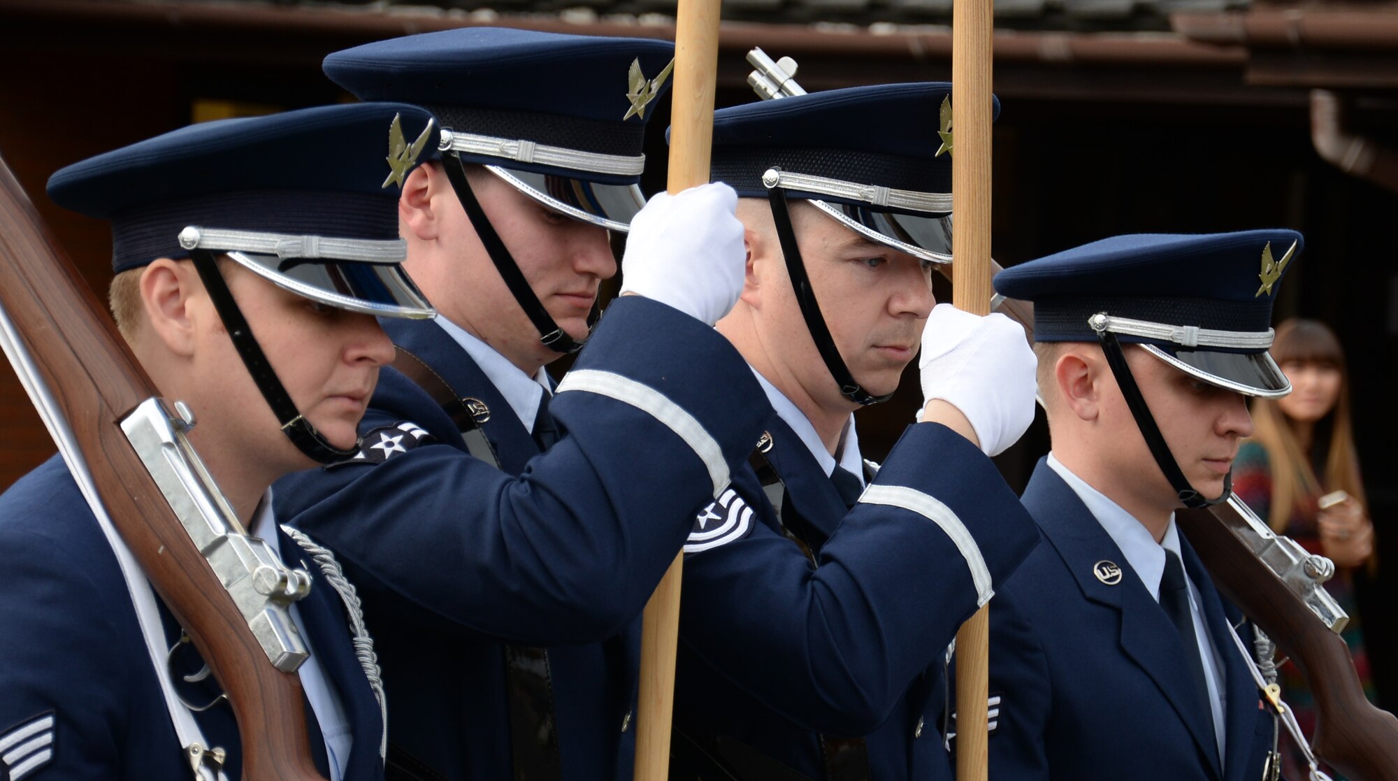 Airmen from the Team Mildenhall Honor Guard lead the way in a parade during a Fall Festival Oct. 28, 2016, at the child development center on RAF Mildenhall, England. Following the parade, children and parents took part in games, painting and a pumpkin patch. (U.S. Air Force photo by Gina Randall)