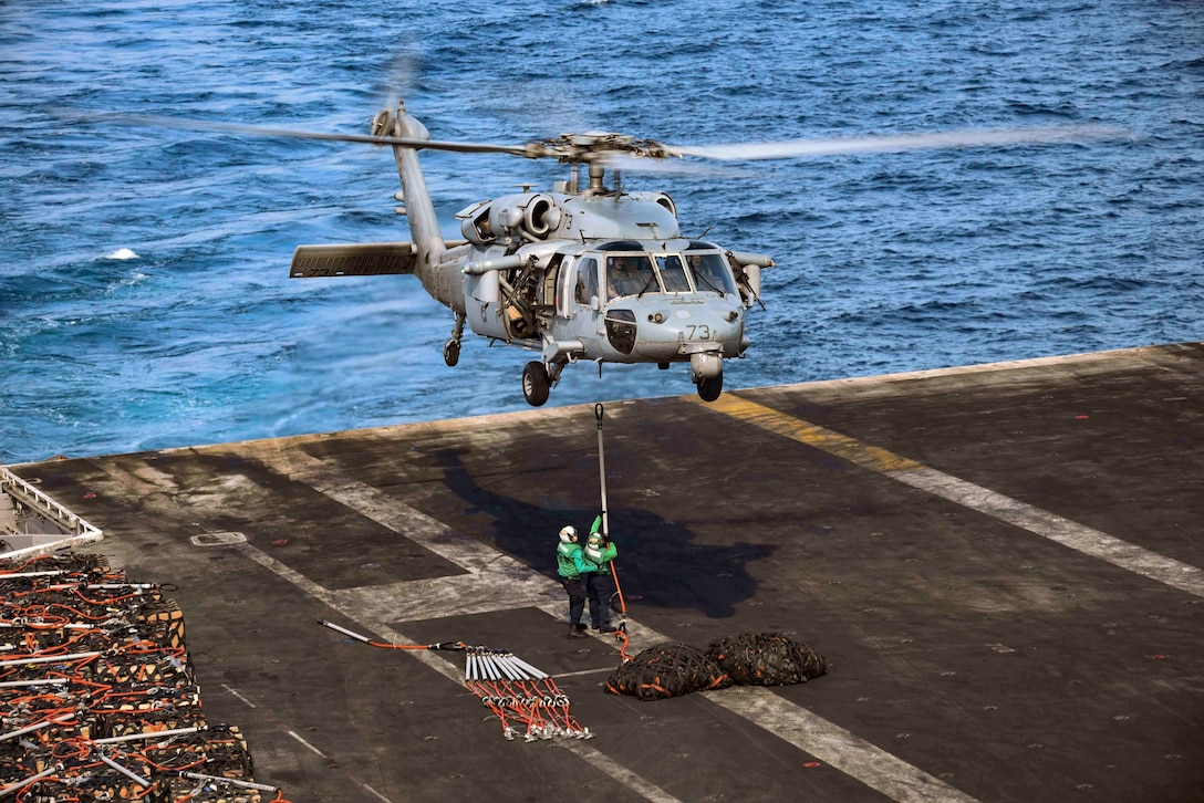 161028-N-IE397-123

ARABIAN GULF (Oct. 28, 2016) An MH-60S Sea Hawk helicopter assigned to the Chargers of Helicopter Sea Combat Squadron (HSC) 26 prepares to transport supply cargo nets to the dry cargo and ammunition ship USNS Alan Shepard (T-AKE 3) from the flight deck of the aircraft carrier USS Dwight D. Eisenhower (CVN 69) (Ike). Ike and its Carrier Strike Group are deployed in support of Operation Inherent Resolve, maritime security operations and theater security cooperation efforts in the U.S. 5th Fleet area of operations. (U.S. Navy photo by Seaman Christopher A. Michaels)