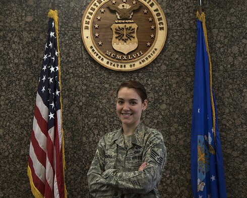 Staff Sgt. Jessica Thomas, 90th Missile Wing legal NCO in charge of military justice, poses inside the court room  at F.E. Warren Air Force Base, Wyo., Oct. 27, 2016. Thomas is known for keeping a positive attitude and working with a smile on her face. (U.S. Air Force photo by Senior Airman Brandon Valle)