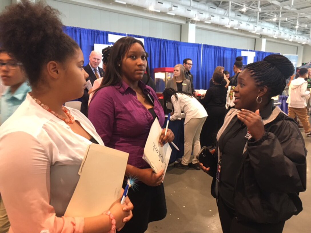 (Right) Stephanie Coleman, an Equal Opportunity Employment specialist from the U. S. Army Corps of Engineers Nashville District talks with students for future STEM careers during the “My Future, My Way” Career Exploration Fair at the Metro Nashville Public schools Academies of Nashville and the Nashville Area Chamber of Commerce at Music City Convention Center Oct. 27, 2016.