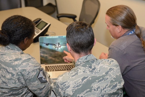 In a collaborative effort, 15th IS Airmen, along with their counterparts across the country utilize intelligence to create a targeting analysis product to address the new tactics being used against coalition forces. Graphic Illustration/ Lori Bultman, Vince Childress