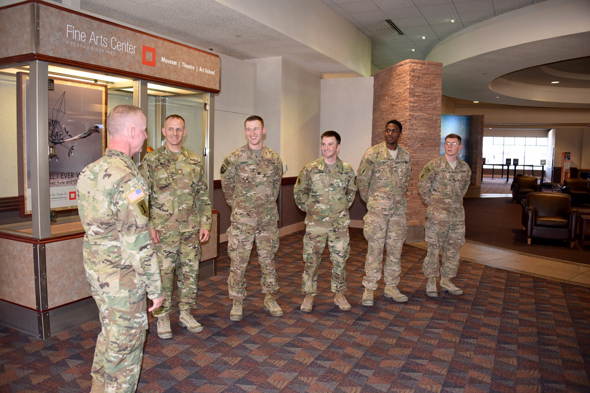 Army Col. Tim Lawson, deputy commander for support, U.S. Army Space and Missile Defense Command/Army Forces Strategic Command, welcomes Soldiers home from deployment Oct. 19 at the Colorado Springs Airport. Maj. Brian Beck, Capt. Matthew Wooley, Staff Sgt. Joseph Chapman, Sgt. Travis Bowman and Spc. Richard Tankle were greeted at the airport by fellow Soldiers and family members as they returned home from the nine-month deployment. (U.S. Army photo by Dottie White)