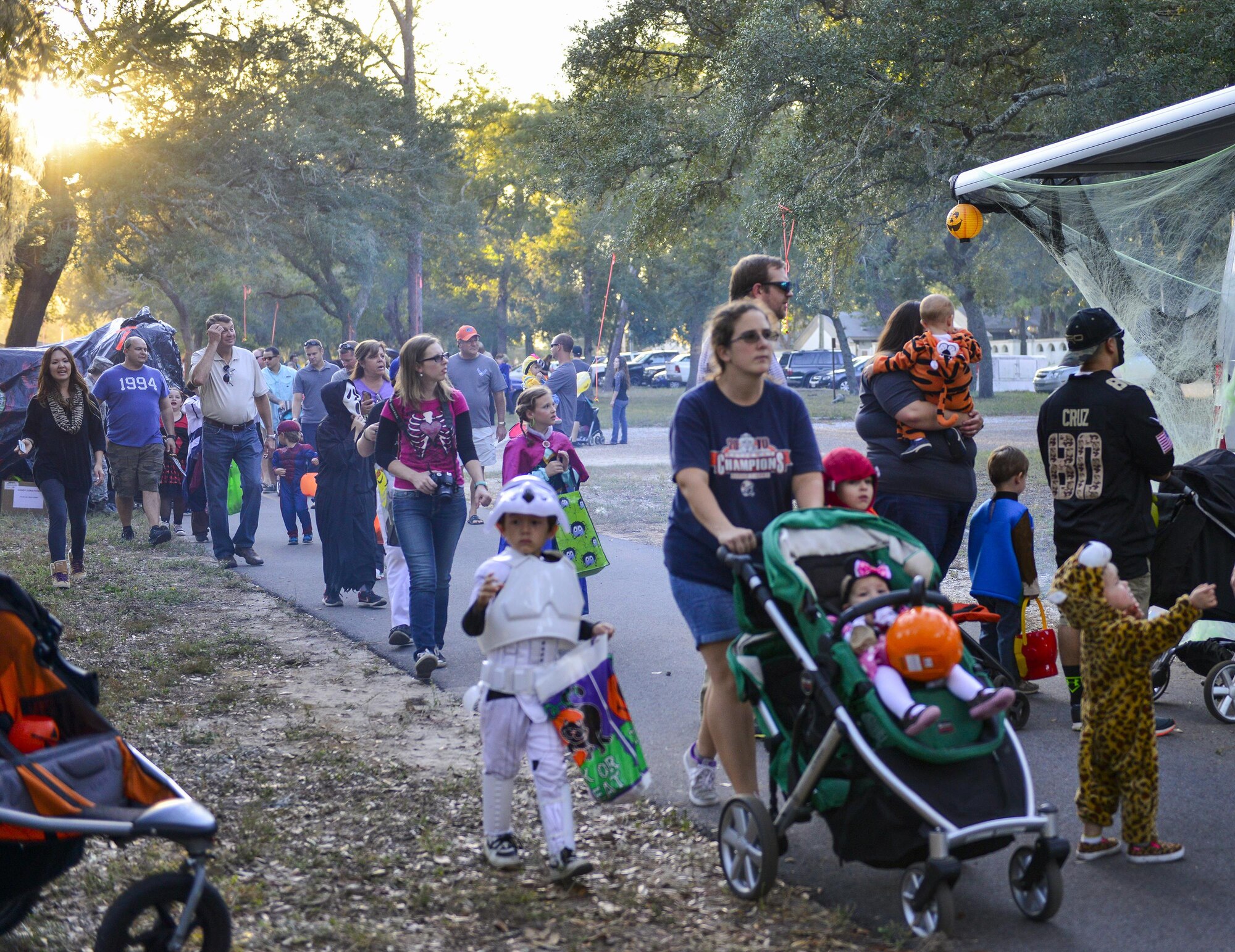 A large crowd moves through the base’s annual Trunk or Treat event Oct. 28 at Eglin Air Force Base, Fla.  More than 200 parents and children dressed up for the trick or treat event that showcased games and other activities.  (U.S. Air Force photo/Jasmine Porterfield)