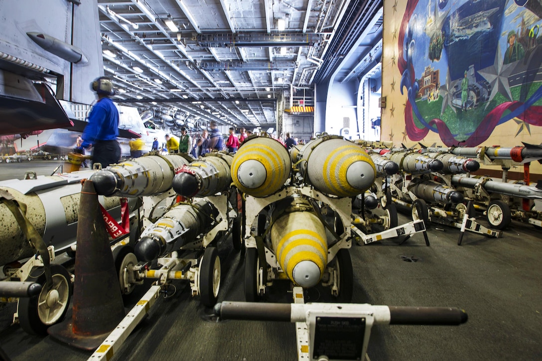 Ordnance awaits storage in the hangar bay of the aircraft carrier USS Dwight D. Eisenhower in the Persian Gulf, Oct. 27, 2016. Navy photo by Petty Officer 3rd Class Andrew J. Sneeringer