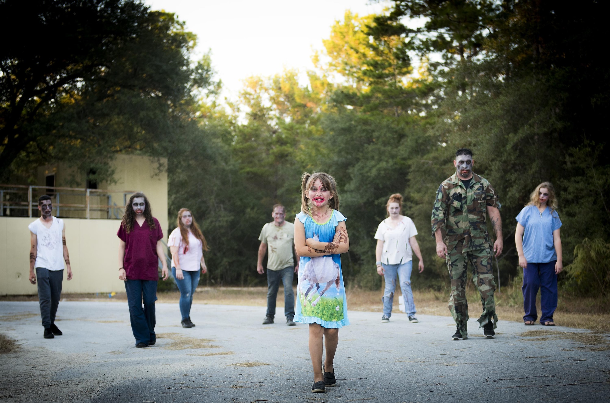 A herd of zombies begins to form during the annual Zombie Stomp run Oct. 29 at Eglin Air Force Base, Fla.  More than 100 runners participated in ducking, dodging and evading hungry zombies over the 5k course near Base Tango.  (U.S. Air Force photo/Samuel King Jr.)