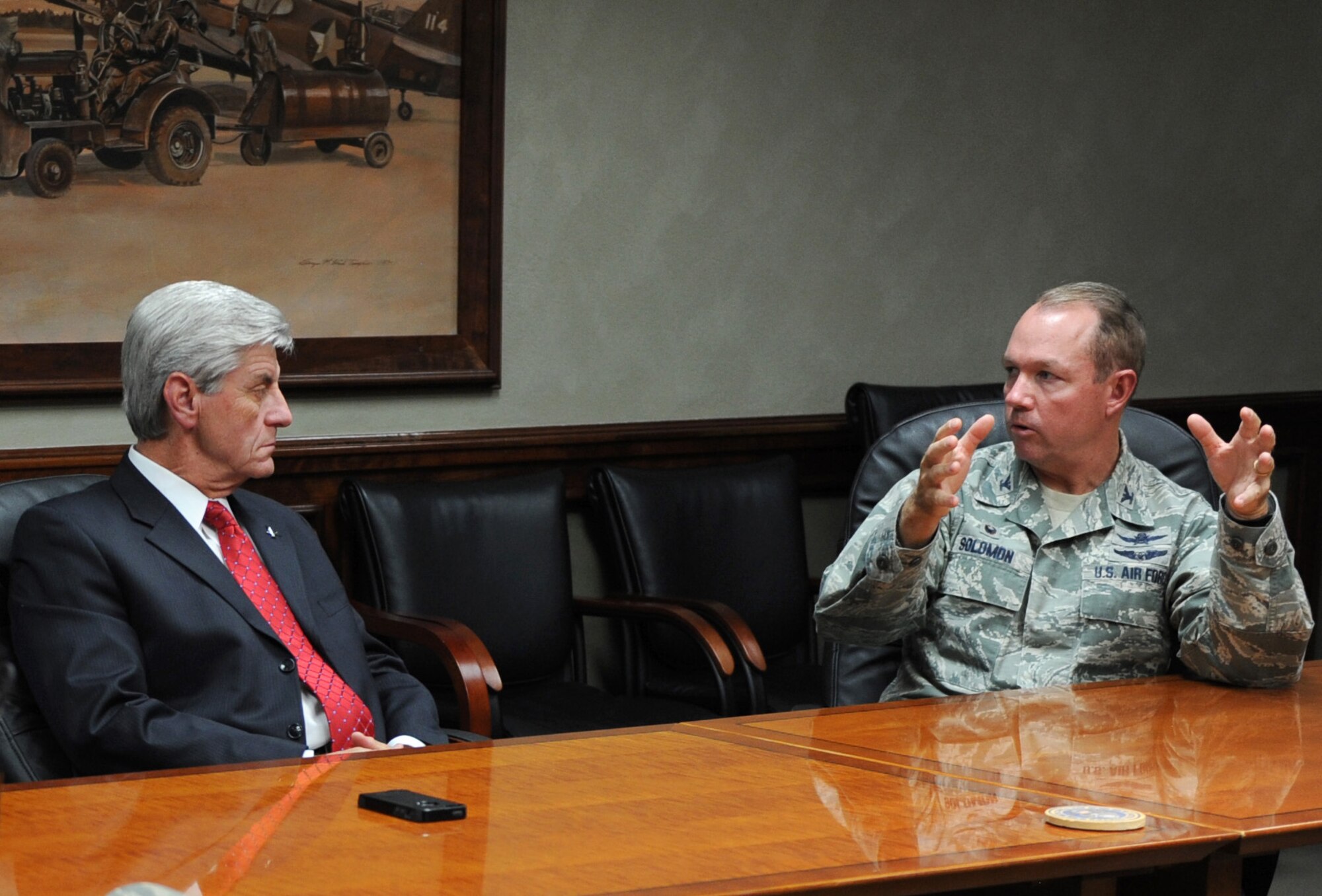 Col. Scott Solomon, 81st Training Group commander, briefs Mississippi Governor Phil Bryant on cyber training during a 333rd Training Squadron mission briefing at Stennis Hall Oct. 25, 2016, on Keesler Air Force Base, Miss. During his visit at Keesler, Bryant also received a windshield tour of the new entry gate project. (U.S. Air Force photo by Kemberly Groue/Released)