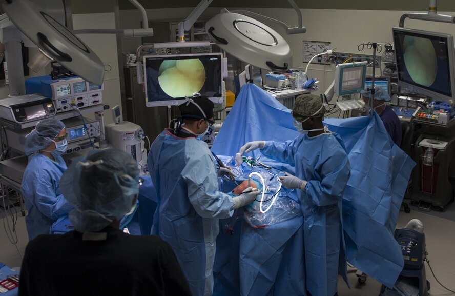 Airmen from the 99th Surgical Operations Squadron perform surgery to repair an Airman’s ACL at the Mike O’Callaghan Federal Medical Center on Nellis Air Force Base, Nev., Oct. 17, 2016. The orthopedic unit performs a number of surgeries including sports-type arthroscopy, and treatment of rotator cuff disorders, instability of the shoulder procedures, to ligament, meniscal surgeries and total joint arthroplasties for the knees and hips. (U.S. Air Force photo by Airman 1st Class Kevin Tanenbaum/Released)