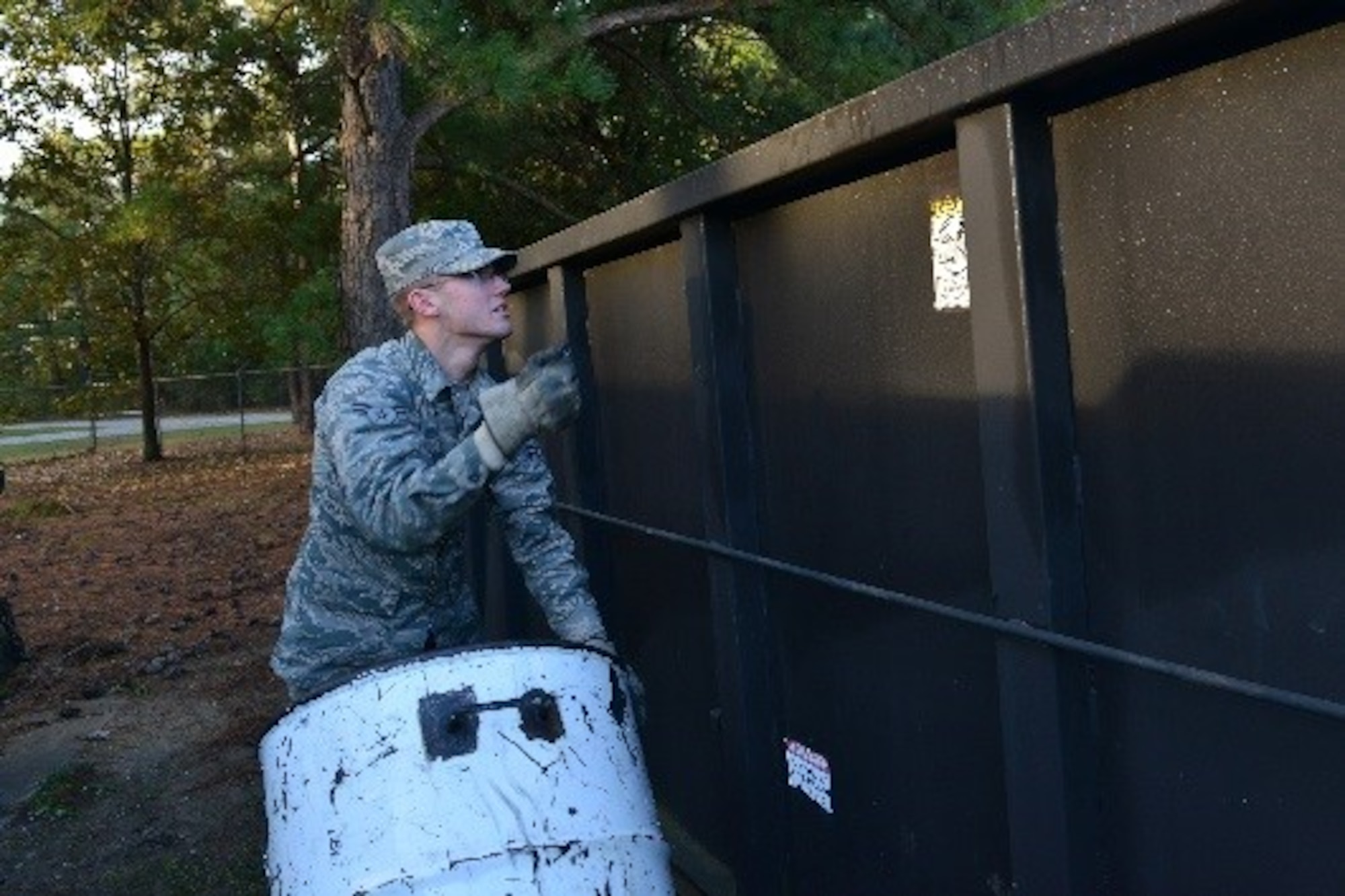 U.S. Air Force Airman 1st Class Alexander Olnhausen, 20th Equipment Maintenance Squadron aircraft structural maintenance apprentice, puts metal into a recycling bin at Shaw Air Force Base, S.C., Oct. 28, 2016. The Shaw Recycling Center accepts materials including wood and metals on Mondays, Wednesdays and Fridays from 7:30 a.m. to 4:30 p.m. (U.S. Air Force photo by Airman 1st Class Destinee Sweeney)