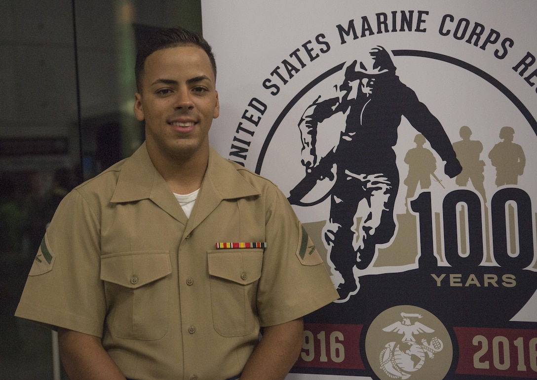 Lance Cpl. Santos Alfonso Nieves Baez, a landing support specialist with Detachment 1, Landing Support Company, Combat Logistics Regiment 45, 4th Marine Logistics Group, poses for a picture before the Marine Corps Reserve Centennial celebration concert begins at the Centro de Bellas Artes de Humacao, Oct. 20, 2016. Baez was joined by his unit, Marine Corps Band New Orleans and members of the Puerto Rican community to commemorate the Centennial of the  Marine Corps Forces Reserve. (U.S. Marine Corps photo by Sgt. Sara Graham) 
