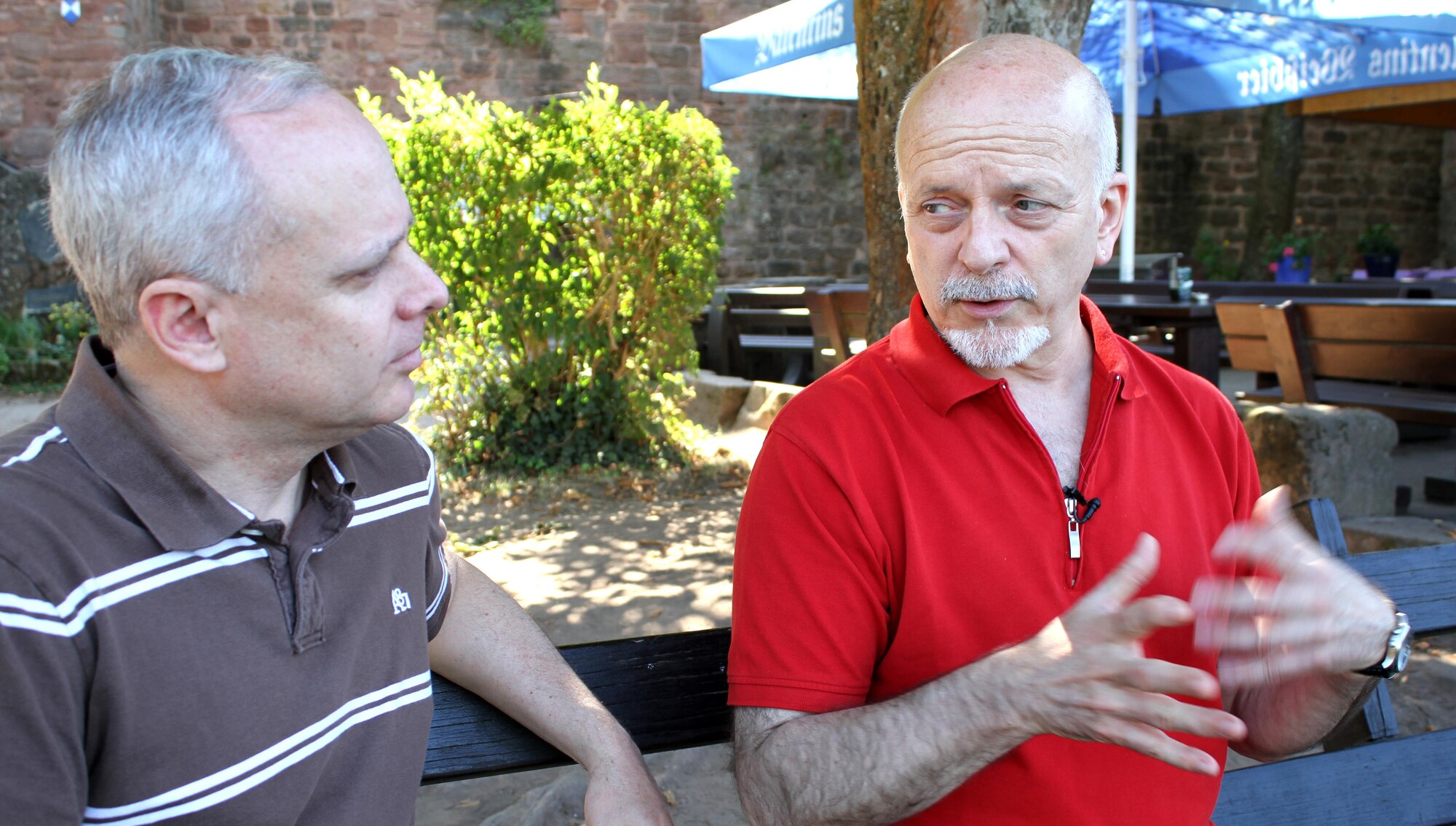 At right, Karl Willi Ningelgen talks about the evolution on environmental practices in Germany with his coworker Sean McCain. (U.S. Air Force Photo/Debbie Aragon)